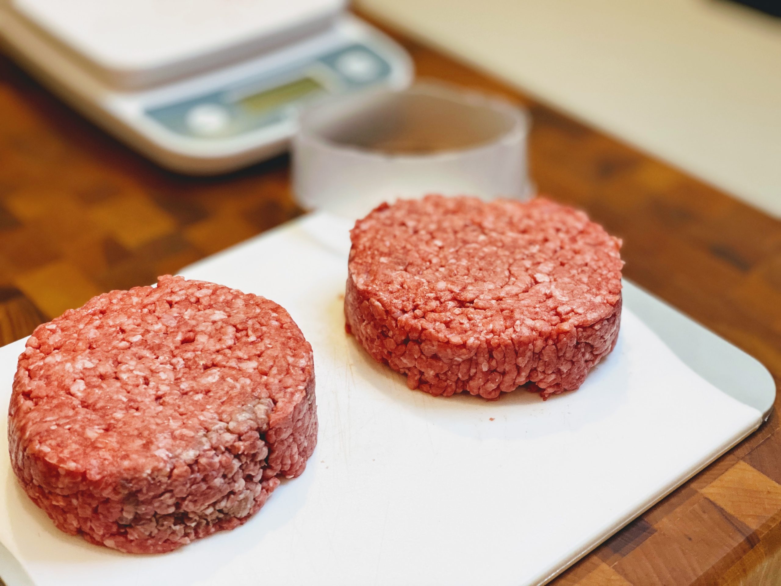 Ground beef in burger patty form.